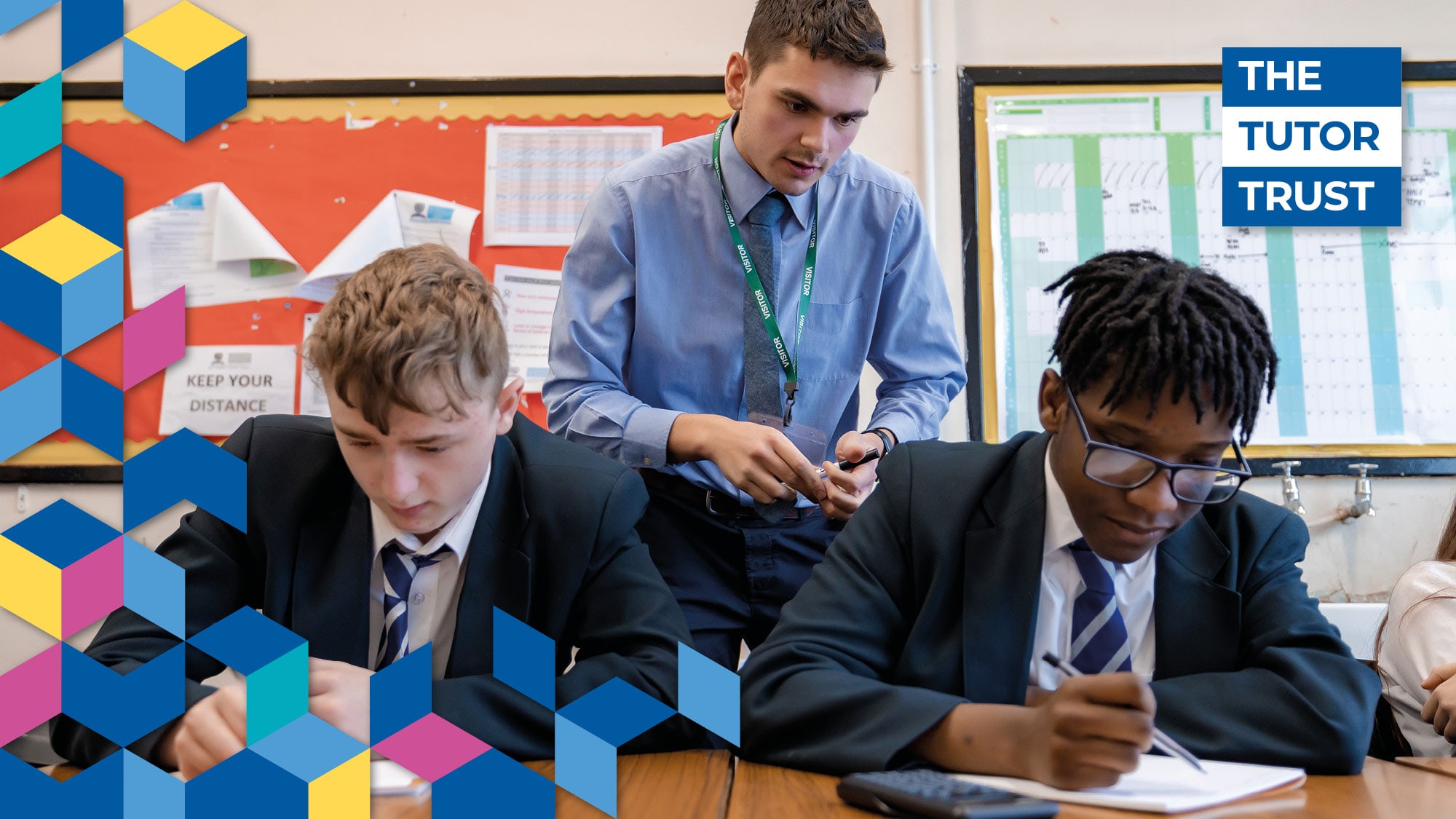 Photo of two teenage boys being learning in a class room