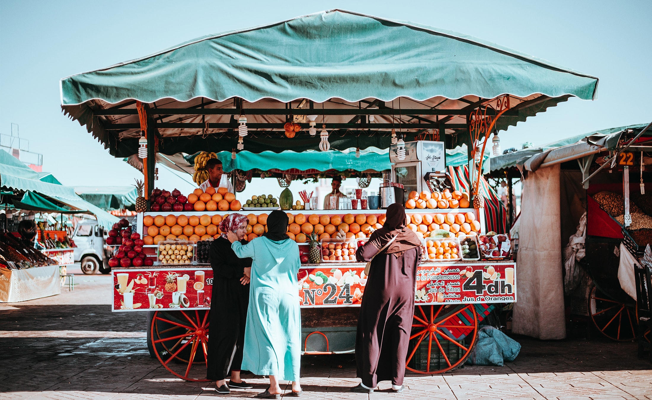 Women at a market stall in Marrakesh, Morocco